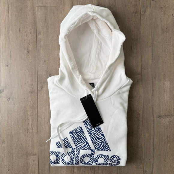adidas Tops - Adidas White Hoodie with Zebra Patterned Blue Logo NWT